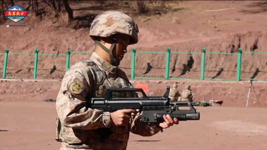 A PLA Army Tibet Military District soldier firing a QLG-91 under-barrel grenade launcher in February 2026